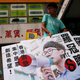 Student activist Joshua Wong carries banners of Nathan Law, candidate from Demosisto on election day for the Legislative Council in Hong Kong, September 4, 2016.
